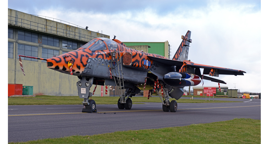E_Spotty_Sepecat_Jaguar_XX119_leaves_the_RAF_Museum_Cosford_for_a_new_home_with_No_6_Squadron_at_Lossiemouth.jpg