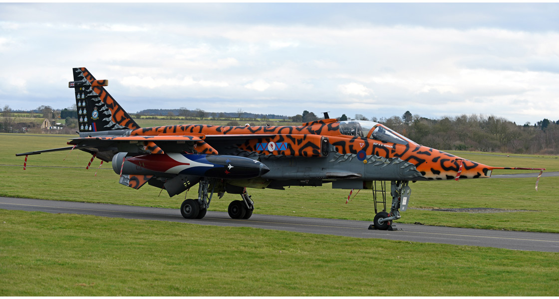B_Spotty_Sepecat_Jaguar_XX119_leaves_the_RAF_Museum_Cosford_for_a_new_home_with_No_6_Squadron_at_Lossiemouth.jpg